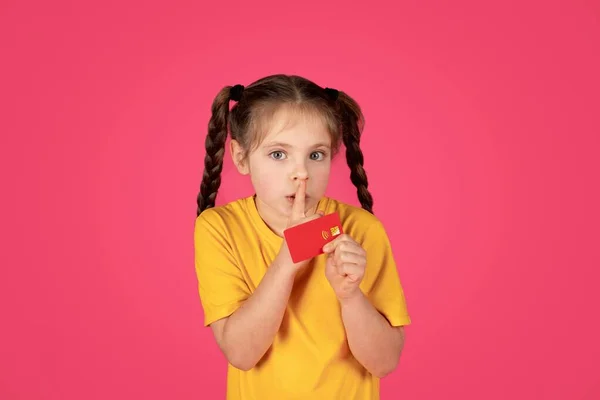 Cute Little Girl Holding Credit Card Showing Shh Gesture Funny — Stock Photo, Image