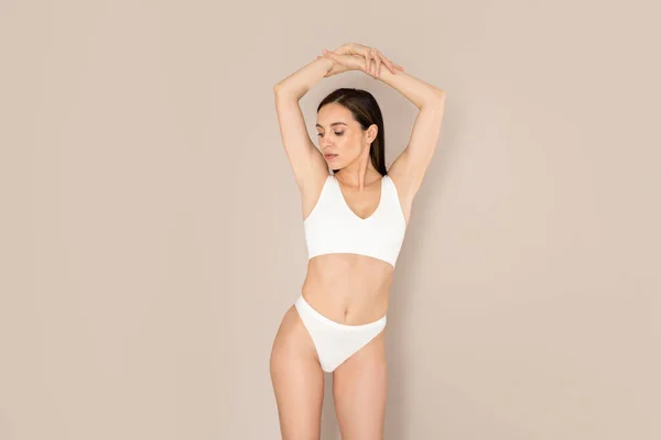 Young Slim Caucasian Lady Perfect Body Shape Posing Beige Studio Stock  Photo by ©Milkos 617052366