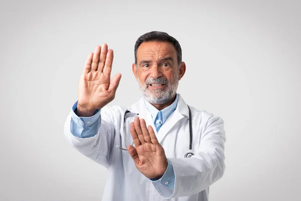 Unhappy Caucasian Mature Man Doctor White Coat Making Stop Gesture — Stock Photo, Image