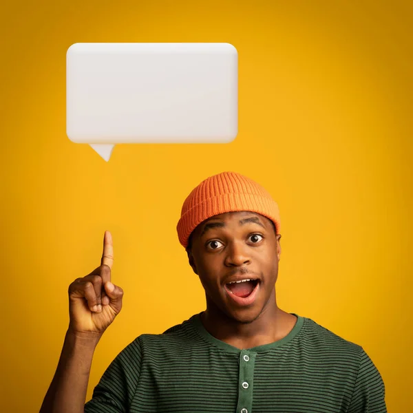 stock image I Have Idea. Inspired Young Black Guy Raising Finger Up Pointing At Empty Cloud, Showing Text Bubble Above Head Posing Looking At Camera Over Yellow Studio Background. Copy Space, Square Shot