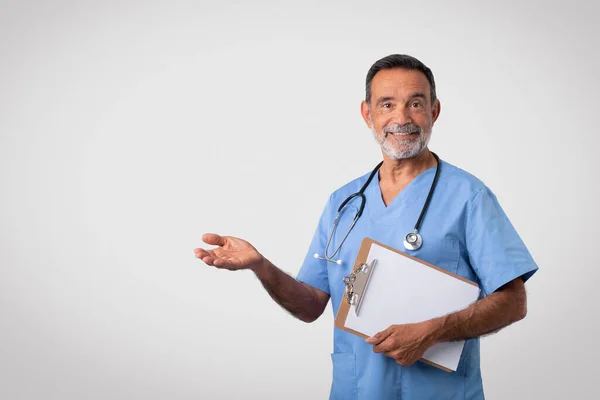 Happy Caucasian Mature Man Doctor Uniform Tablet Holds Empty Space — Stock Photo, Image