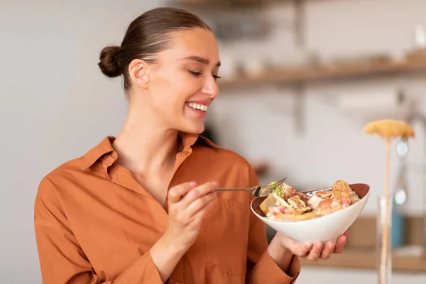 Satisfied Happy Young European Woman Enjoying Tasty Caesar Salad Sitting — Stock Photo, Image
