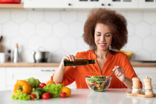 Smiling African American Woman Cooking Fresh Vegetable Salad Kitchen Adding — Stock Photo, Image