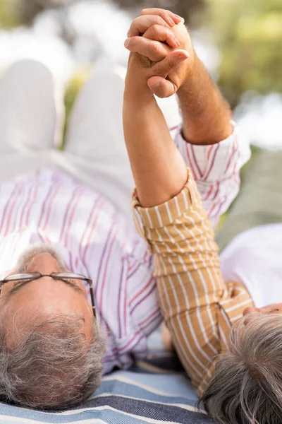 Happy Senior European Retired Husband Wife Hold Hands Lie Plaid — Stock Photo, Image