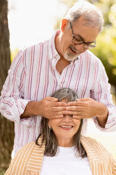 Smiling Senior European Husband Closes Eyes Wife Couple Enjoy Walk — Stock Photo, Image