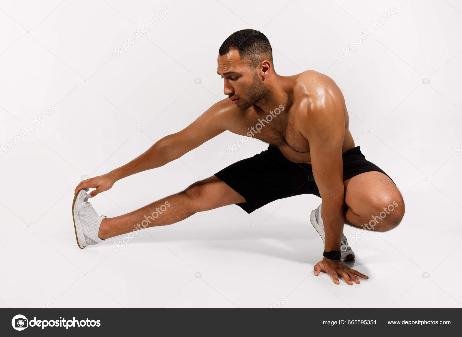 Fitness Workout Athletic African American Man Doing Hamstring Stretches  Exercising Stock Photo by ©Milkos 665595354