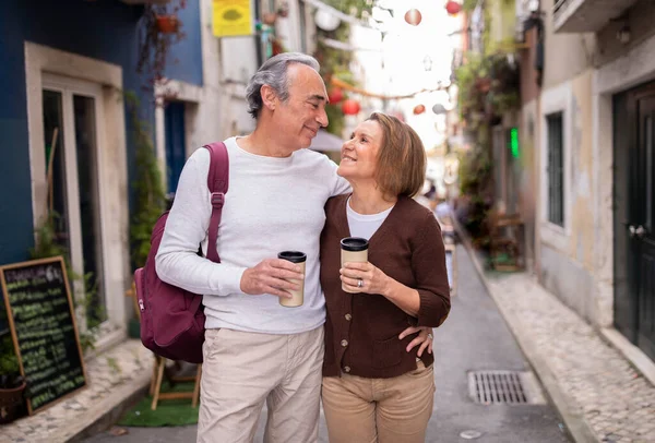 Seniors Vacation Romantic Mature Couple Enjoying Walk Coffee Hugging Smiling — Stock Photo, Image
