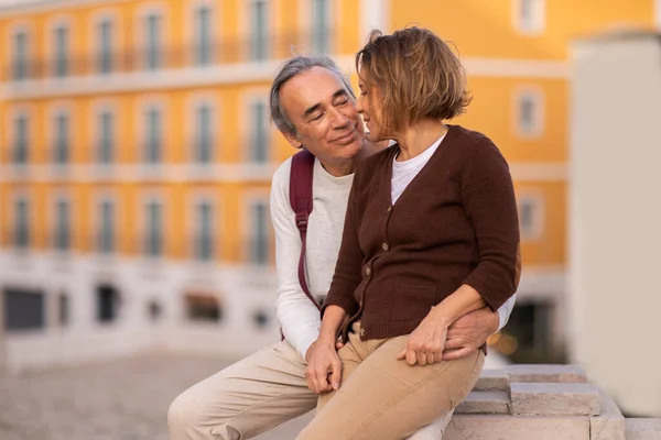 Vacation Europe Happy Senior Couple Enjoying Time Together Embracing Sitting — Stock Photo, Image