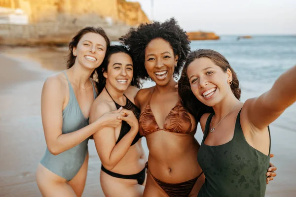 Summer selfie, beach and diverse women friends enjoying holiday, vacation and weekend together. Group of ladies smiling, taking photo for social media