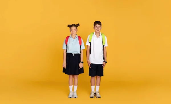 Glad Teen European Boy Girl Backpacks Ready Study Isolated Yellow — Stock Photo, Image