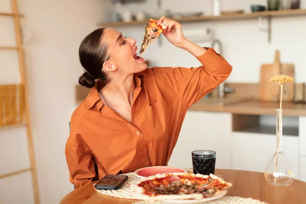 Young Caucasian Woman Biting Slice Home Cooked Pizza Enjoying Tasty — Stock Photo, Image