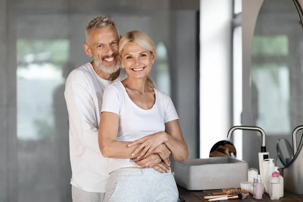 Happy Mature Spouses Embracing Bathroom While Getting Ready Morning Romantic — Stock Photo, Image