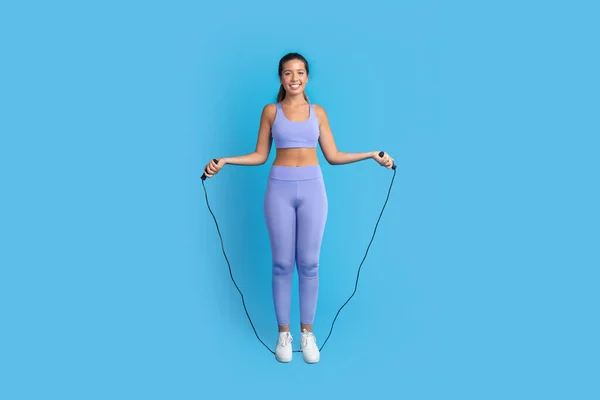 Smiling Slim Millennial European Woman Sportswear Jumping Jump Rope Isolated — Stock Photo, Image