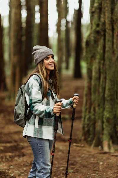 Glad Young Caucasian Lady Tourist Jacket Trekking Sticks Walk Forest — Stock Photo, Image