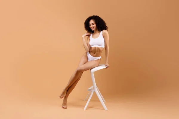 Slender Latin Lady White Underwear Sitting White Chair Brown Studio — Stock Photo, Image