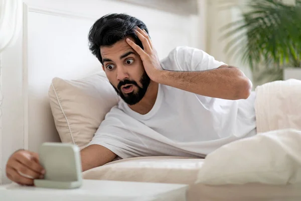 Late Work Shocked Overslept Indian Guy Looking Alarm Clock Woke — Stock Photo, Image