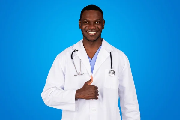 Positive Young African American Guy Doctor White Coat Show Thumb — Stock Photo, Image