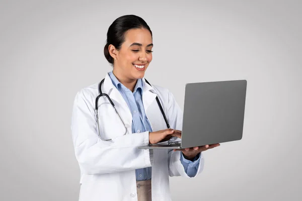 Smiling Confident Latin Female Doctor White Coat Stethoscope Typing Laptop — Stock Photo, Image