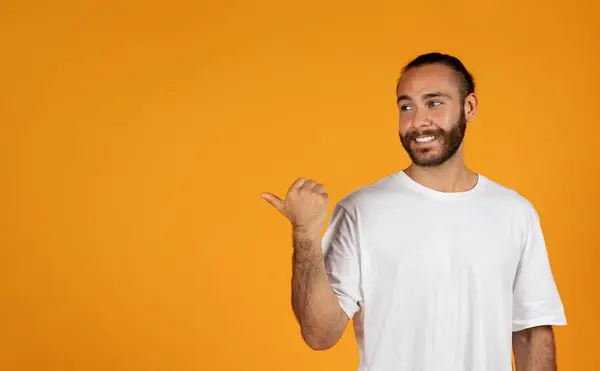 Smiling Handsome Adult European Guy Beard White Shirt Points Finger — Stock Photo, Image