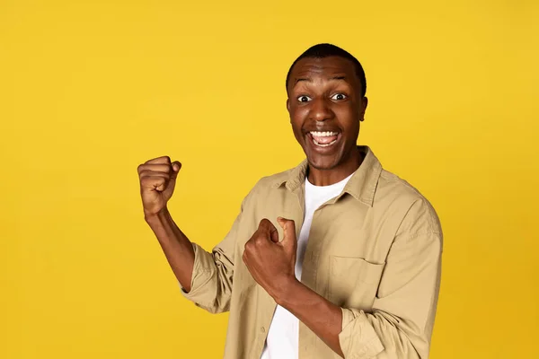 Happy Millennial African American Man Casual Open Mouth Raises Fists — Stock Photo, Image