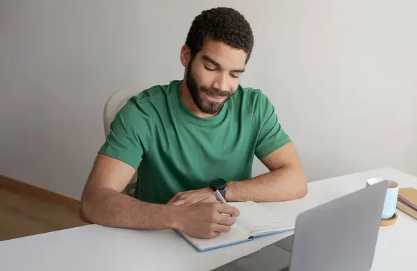 Positive Young Muslim Guy Student Manager Making Notes Works Laptop — Stock Photo, Image