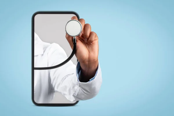 Hand of black woman doctor in white coat listen breath with stethoscope on smartphone with blank screen, isolated on blue background studio, cropped. Healthcare services app