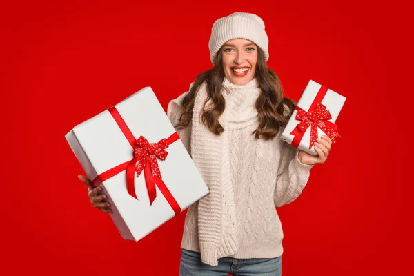 Young Woman Presenting Xmas Wrapped Boxes Standing Gifts Red Studio — Stock Photo, Image