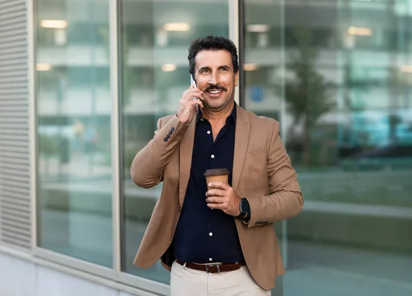 Middle Eastern Businessman Talking Phone While Walking Street Holding Takeaway — Stock Photo, Image