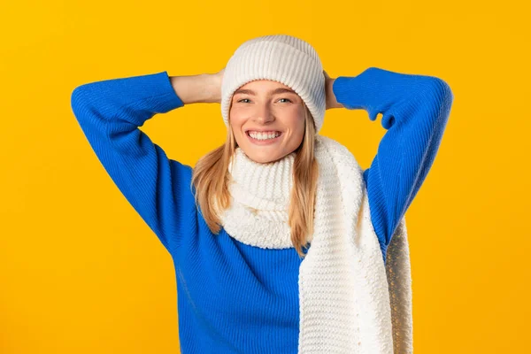 Cheerful Woman Blue Sweater Touches Her White Knitted Hat Exuding — Stock Photo, Image