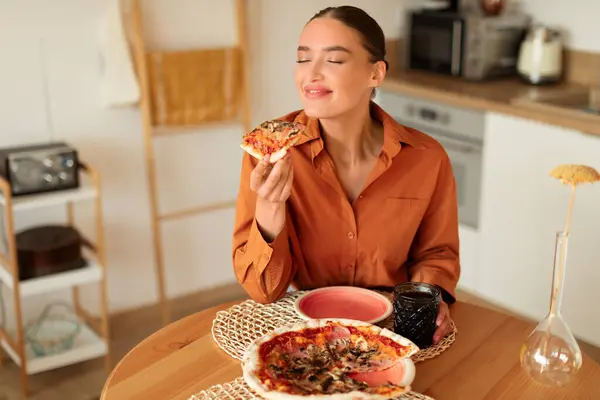 Delighted Woman Blouse Relishes Slice Delicious Pizza While Seated Warm — Stock Photo, Image