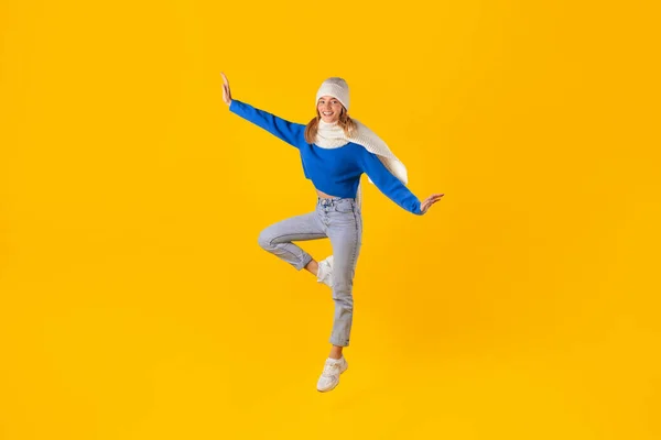 Enthusiastic Woman Winter Clothing Joyfully Jumps Showcasing Her Excitement Winter — Stock Photo, Image