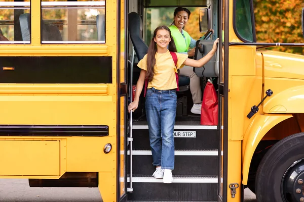 Happy Preteen Girl Getting Yellow School Bus Cheerful Female Kid — стоковое фото