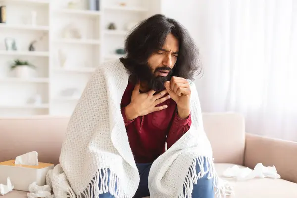 Sick Young Indian Man Coughing While Sitting Couch Full Napkins — Stock Photo, Image