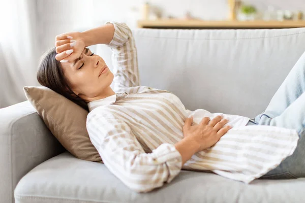 Sick Young Woman Lying Couch Feeling Unwell Home Ill Millennial — Stock Photo, Image
