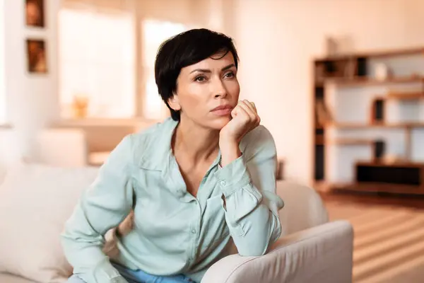 Middle Aged Woman Sitting Thoughtfully Her Living Room Sofa Home — Stock Photo, Image