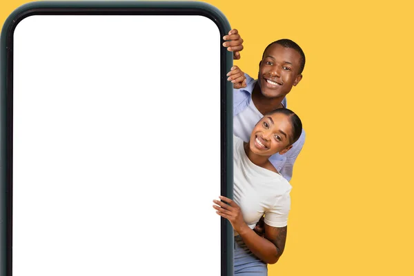 Smiling Black Man Woman Peeking Cheerfully Huge Cellphone Screen Ideal — Stock Photo, Image