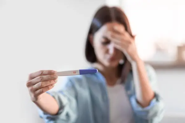 Upset Young Lady Holding Positive Pregnancy Test Home Covering Face — Stock Photo, Image