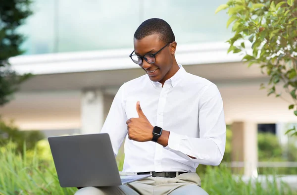 Smiling Black Businessman Using Laptop Outdoors Making Video Call Showing — Stock Photo, Image