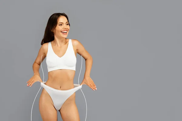 Happy Asian Millennial Woman White Underwear Laughing Playful Stretching Underpants — Stock Photo, Image