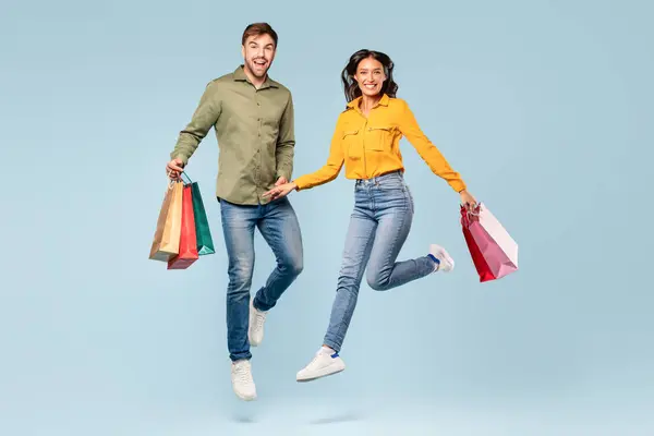 Excited Man Woman Leaping Colorful Shopping Bags Enjoying Fun Day — Stock Photo, Image