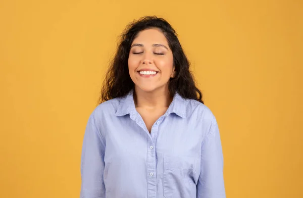Radiant Young Woman Closed Eyes Joyful Smile Wearing Light Blue — Foto Stock