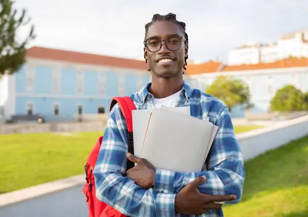 Cheerful Black College Student Guy Stands His Laptop Backpack Books — Zdjęcie stockowe