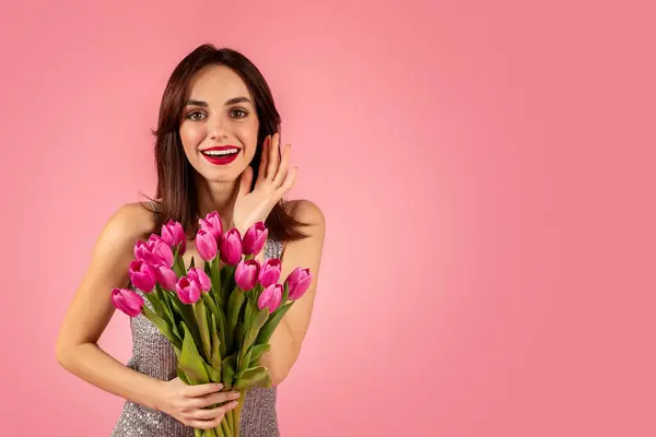Vibrant Young Woman Sparkling Dress Cheerfully Holding Bouquet Pink Tulips — Stok fotoğraf