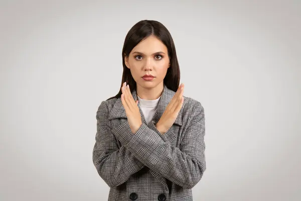 Determined Young Woman Houndstooth Blazer Makes Negative Gesture Crossing Her — Stock Photo, Image
