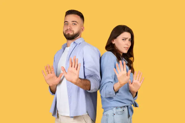 Man Woman Showing Palms Forward Stopping Gesture Wary Expressions Suggesting — Stock Photo, Image
