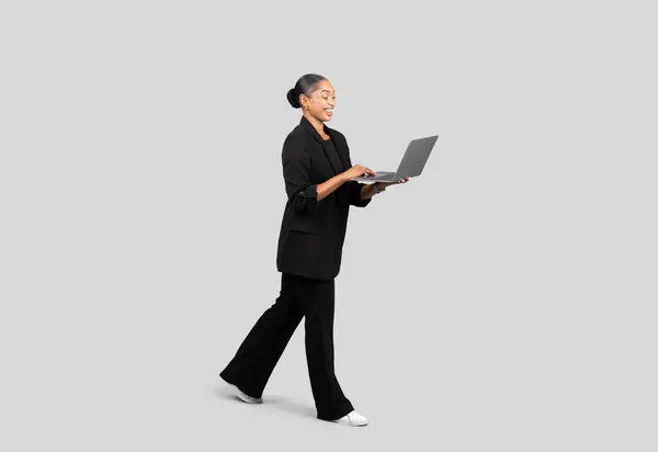 Dynamic Young Businesswoman Motion Dressed Black Suit Working Laptop Joyful — Stock Photo, Image