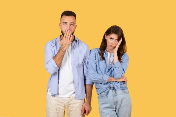 Remorseful Man Places His Hand His Mouth While Woman Rests — Stock Photo, Image