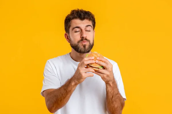Junk Food Hungry European Young Man Eating Tasty Burger Standing — Stock Photo, Image