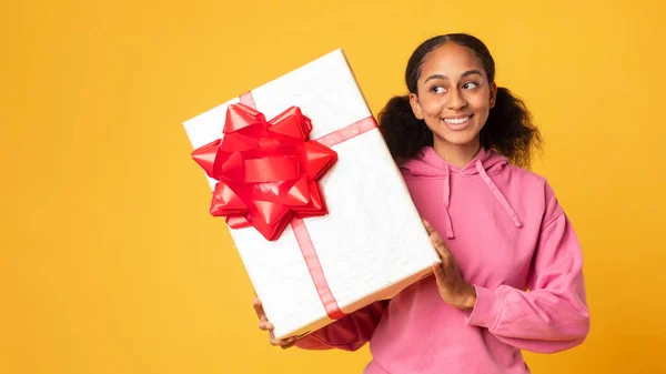 Birthday Present Curious Black Teenager Girl Shaking Large Box Checking — Stock Photo, Image