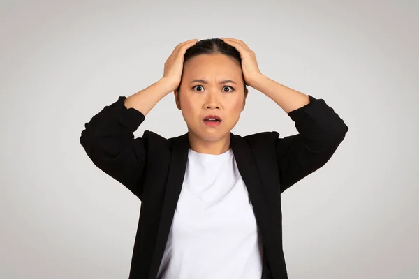 Worried Sad Millennial Asian Businesswoman Troubled Expression Hands Her Head — Stock Photo, Image